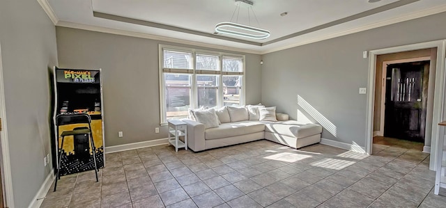 living room with a tray ceiling, light tile patterned floors, and ornamental molding