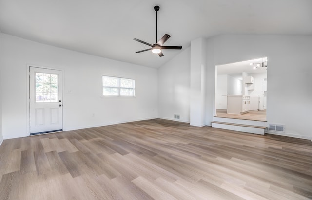 unfurnished living room with ceiling fan, light hardwood / wood-style floors, and lofted ceiling