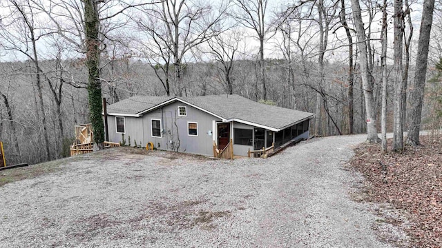 view of front of home featuring a sunroom