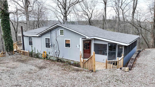 view of front of property featuring a sunroom