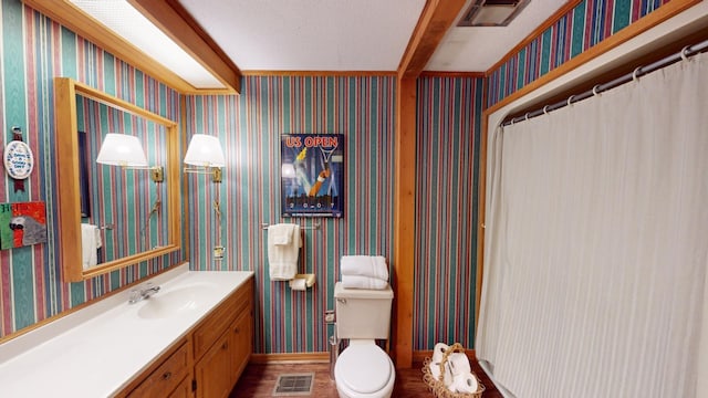 bathroom featuring a shower with curtain, a textured ceiling, vanity, wood-type flooring, and toilet