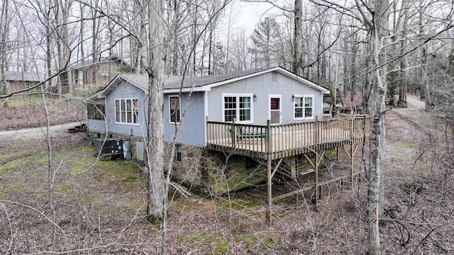 back of property featuring a wooden deck