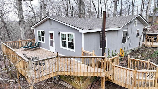 rear view of house featuring a deck