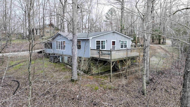 back of property featuring a deck