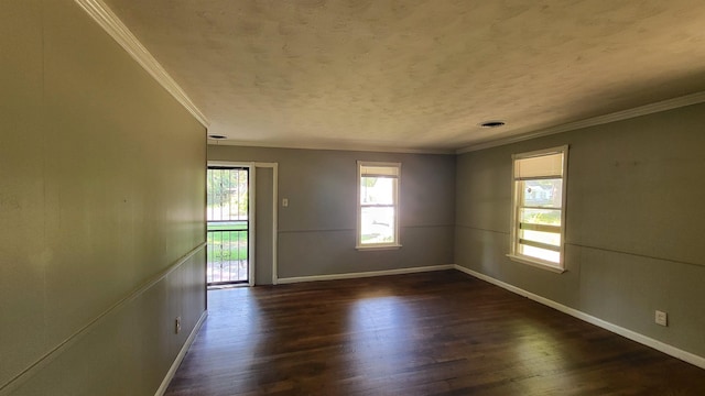 spare room with dark hardwood / wood-style floors and ornamental molding