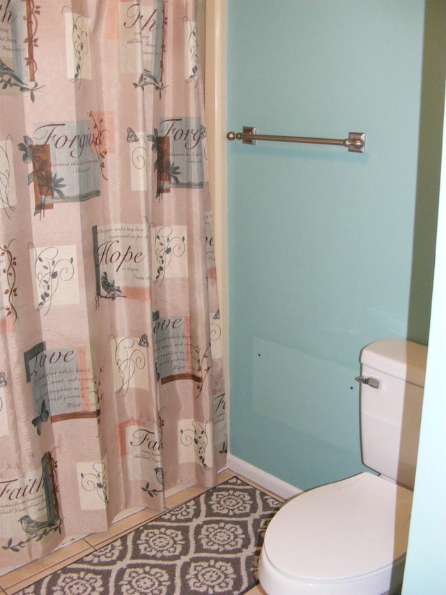 bathroom featuring tile patterned flooring and toilet