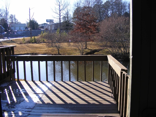 wooden deck with a water view