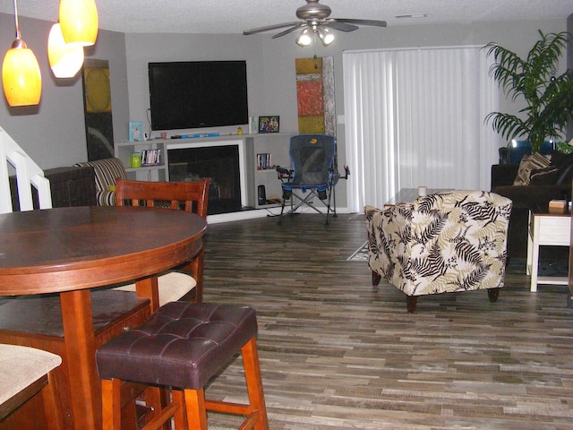 dining area featuring hardwood / wood-style floors and ceiling fan