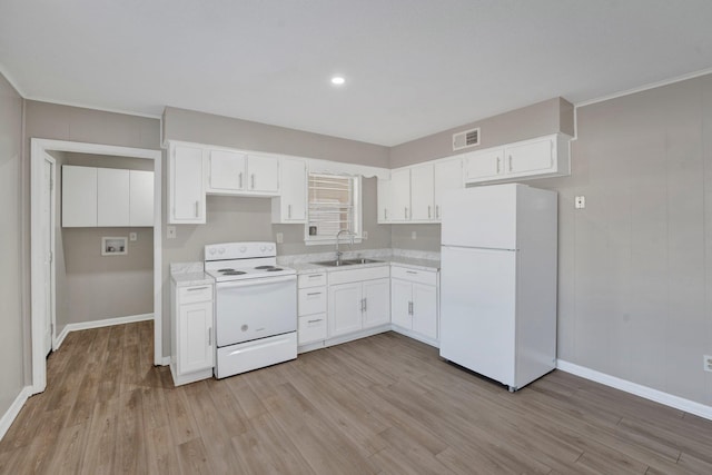 kitchen featuring white cabinetry, white appliances, sink, and light hardwood / wood-style flooring