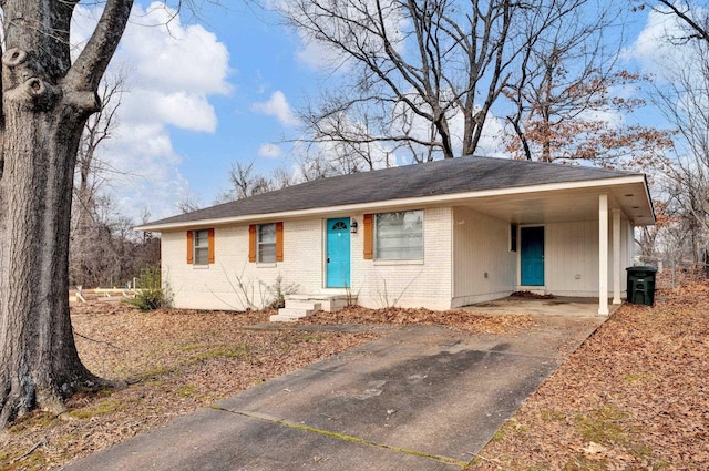 single story home featuring a carport