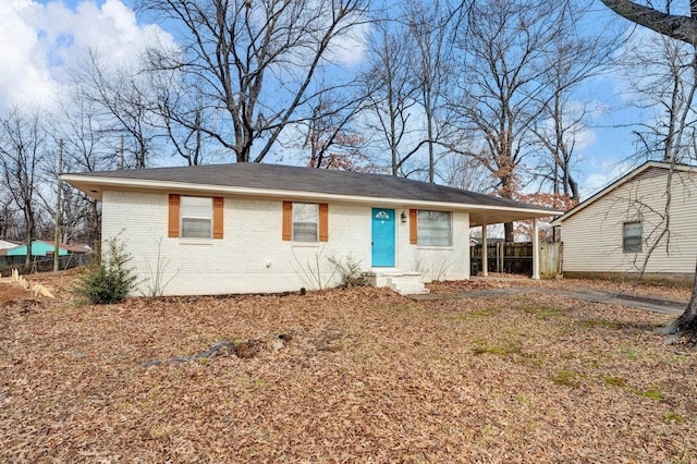 ranch-style home with a carport