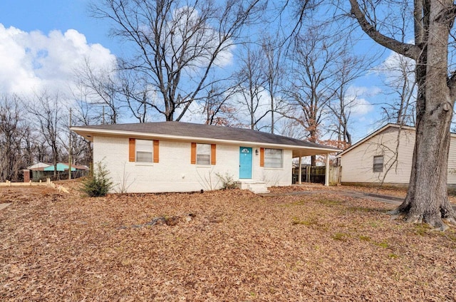 ranch-style home featuring a carport