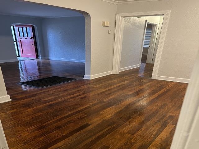 unfurnished room featuring dark hardwood / wood-style floors