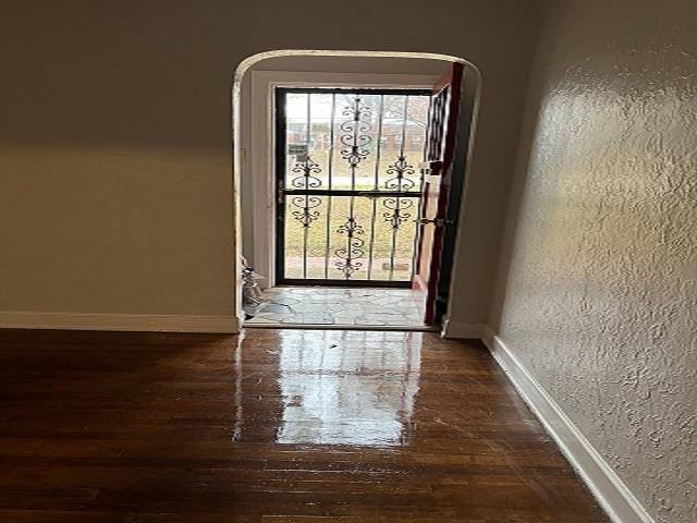 doorway featuring dark hardwood / wood-style floors