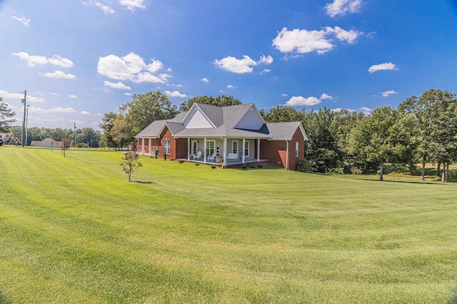 view of front of home featuring a porch and a front lawn