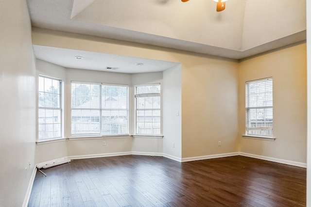 unfurnished room with ceiling fan and dark hardwood / wood-style flooring