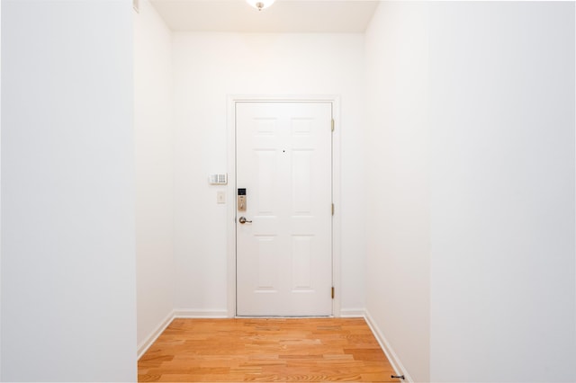 doorway to outside featuring light wood-type flooring