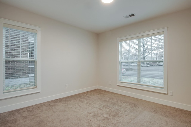 empty room with light colored carpet