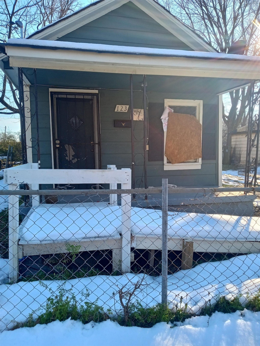 view of snow covered property entrance