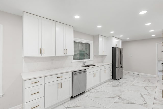 kitchen with sink, white cabinetry, and stainless steel appliances