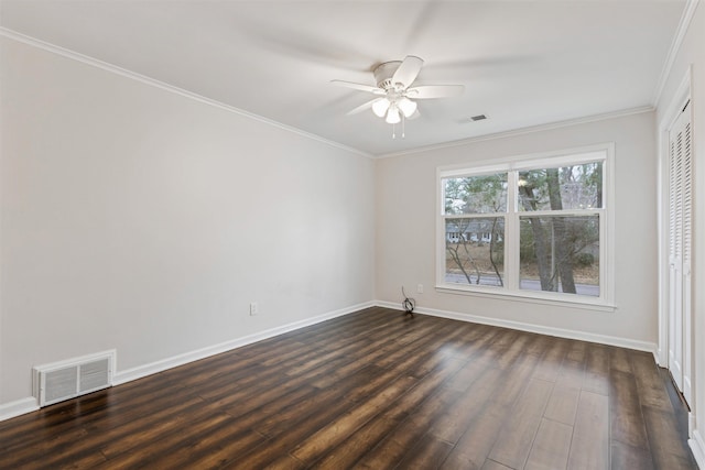 unfurnished room with ceiling fan, dark hardwood / wood-style flooring, and ornamental molding