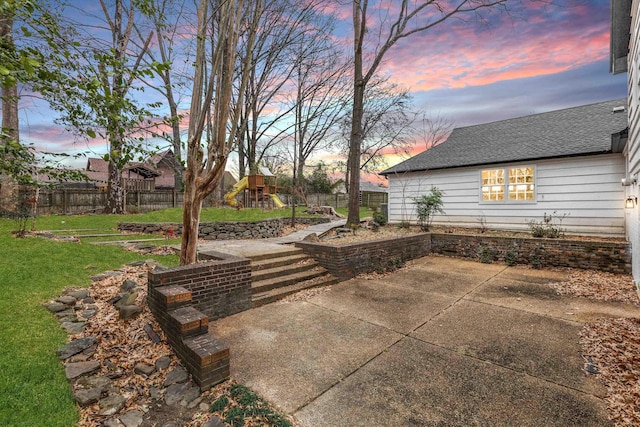 patio terrace at dusk with a lawn