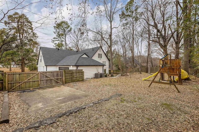 view of yard with cooling unit and a playground