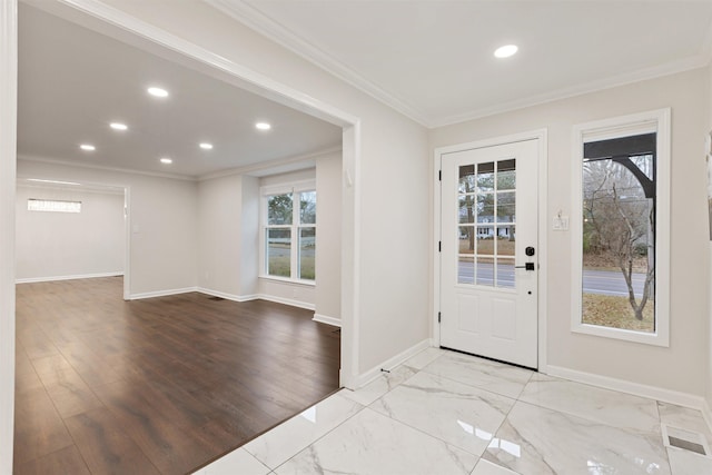 foyer featuring light hardwood / wood-style flooring and ornamental molding