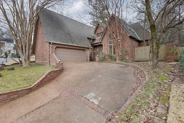 view of front of property with a front yard and a garage