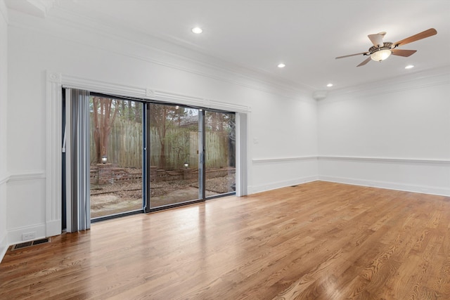 spare room with ceiling fan, light hardwood / wood-style floors, and crown molding