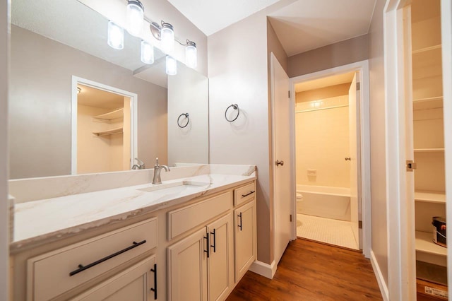 bathroom featuring vanity and wood-type flooring