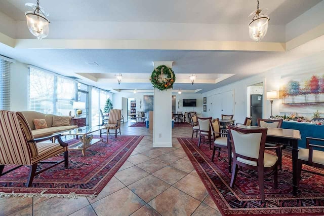 tiled living room with a raised ceiling