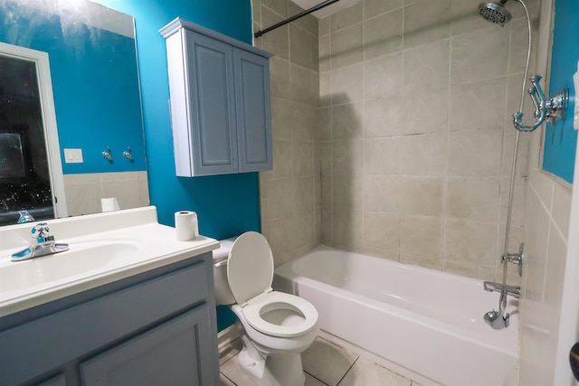 full bathroom featuring vanity, tile patterned floors, toilet, and tiled shower / bath