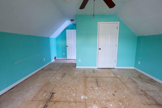 additional living space featuring ceiling fan and vaulted ceiling