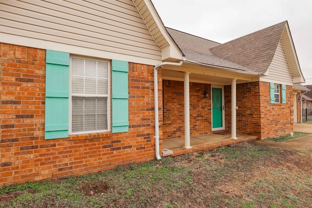 view of side of home featuring a porch