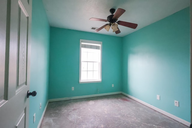 unfurnished room with concrete flooring and ceiling fan