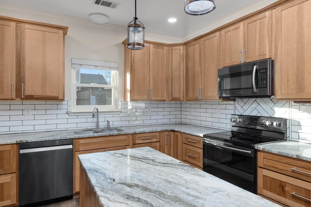 kitchen featuring appliances with stainless steel finishes, decorative light fixtures, tasteful backsplash, sink, and light stone countertops