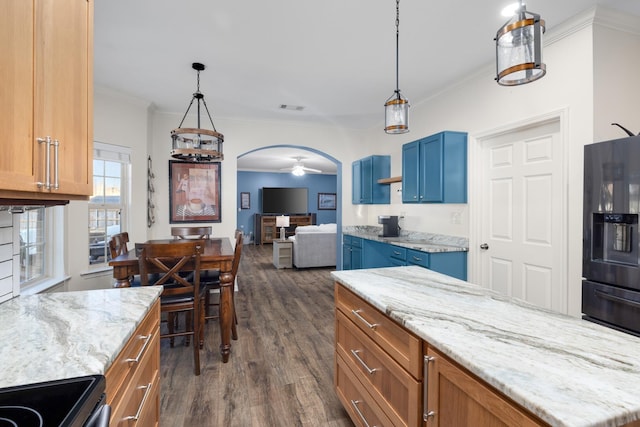 kitchen featuring stainless steel range with electric cooktop, black fridge, light stone counters, crown molding, and dark hardwood / wood-style floors