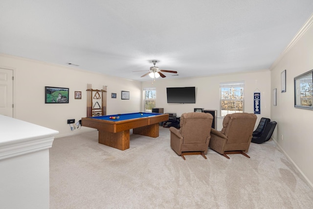 game room featuring pool table, crown molding, a wealth of natural light, and light colored carpet