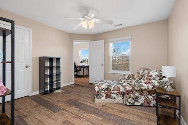 bedroom featuring ceiling fan and dark hardwood / wood-style floors