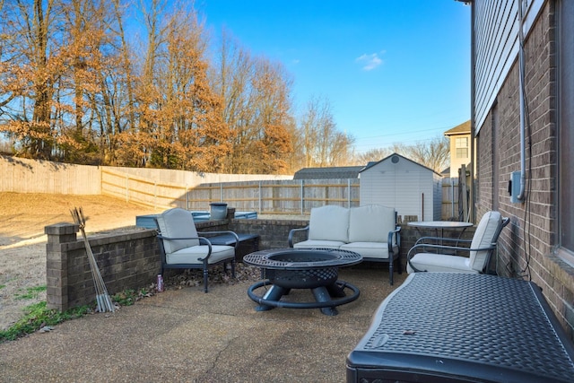 view of patio / terrace with an outdoor living space with a fire pit