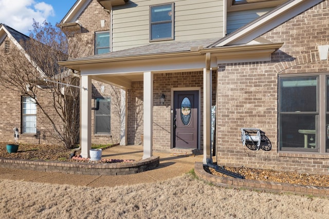 doorway to property featuring covered porch