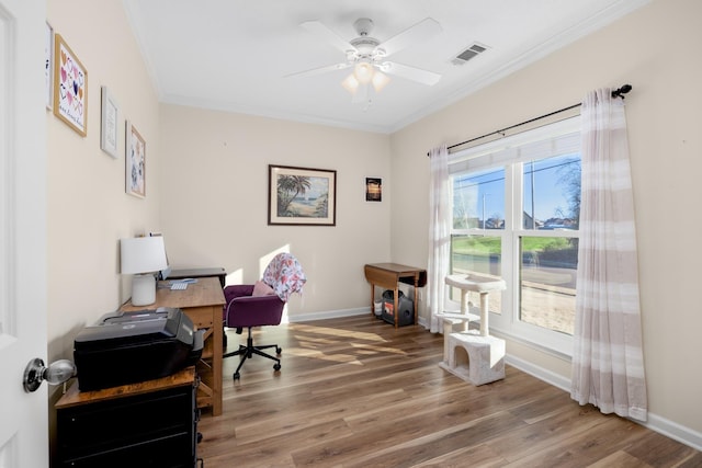 office featuring hardwood / wood-style floors, crown molding, and ceiling fan