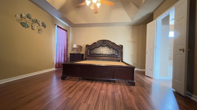 bedroom with ceiling fan and dark hardwood / wood-style floors