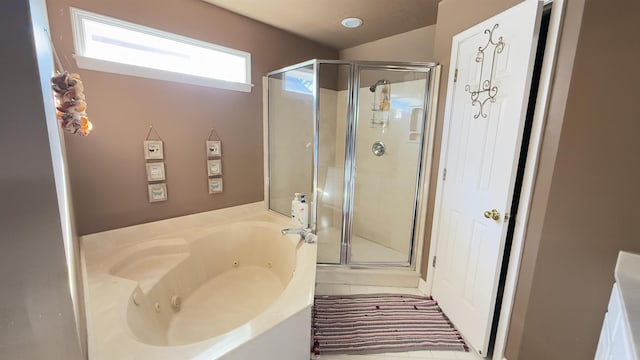 bathroom featuring tile patterned floors and shower with separate bathtub