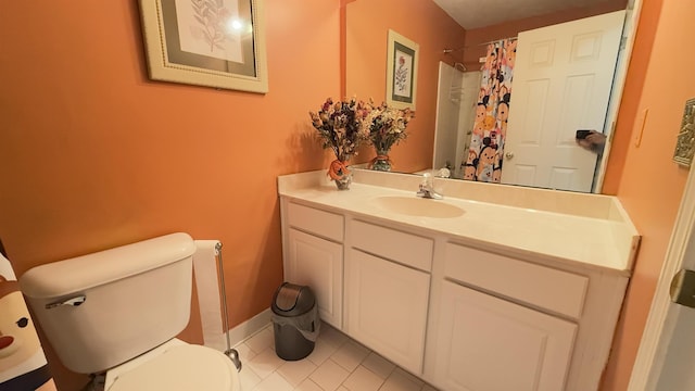 bathroom with a shower with curtain, tile patterned flooring, vanity, and toilet