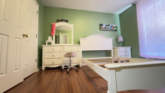 bedroom featuring dark wood-type flooring