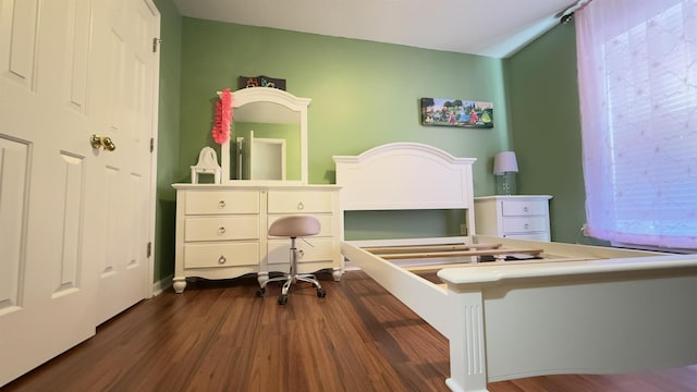 bedroom featuring dark wood-type flooring