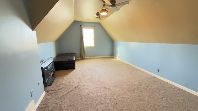 bonus room with ceiling fan, carpet floors, and vaulted ceiling