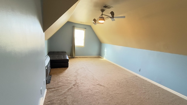 additional living space with carpet, ceiling fan, and vaulted ceiling